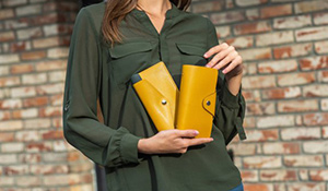 Woman holding two wallets